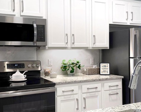 White shaker stock cabinets specified for apartment turns
